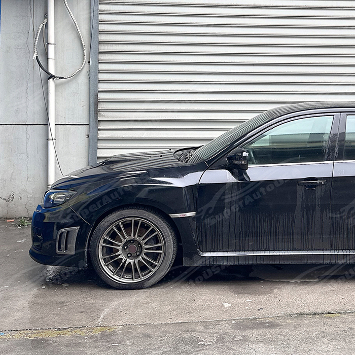 Side perspective emphasizing the deep aerodynamic profile of the front bumper air ducts