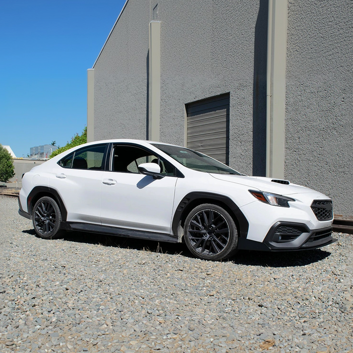 Sleek adjustable front lip spoiler installed on a Subaru WRX VB