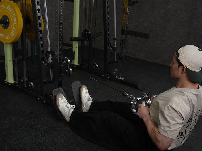 Gym Plus Icon Footrest Attachment FOOTREST-6070 a man performing cable row with footrest